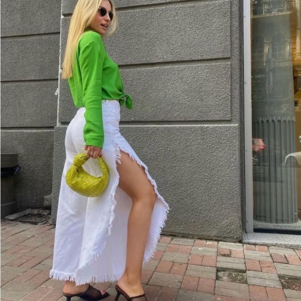 Ksenia Schnaider high waist wide leg frayed white jeans